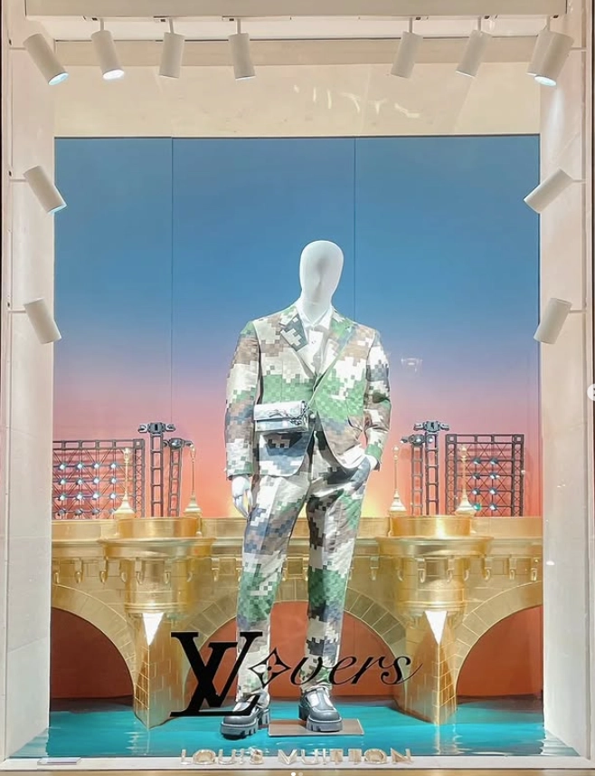 Final installed window display with mannequin and golden bridge