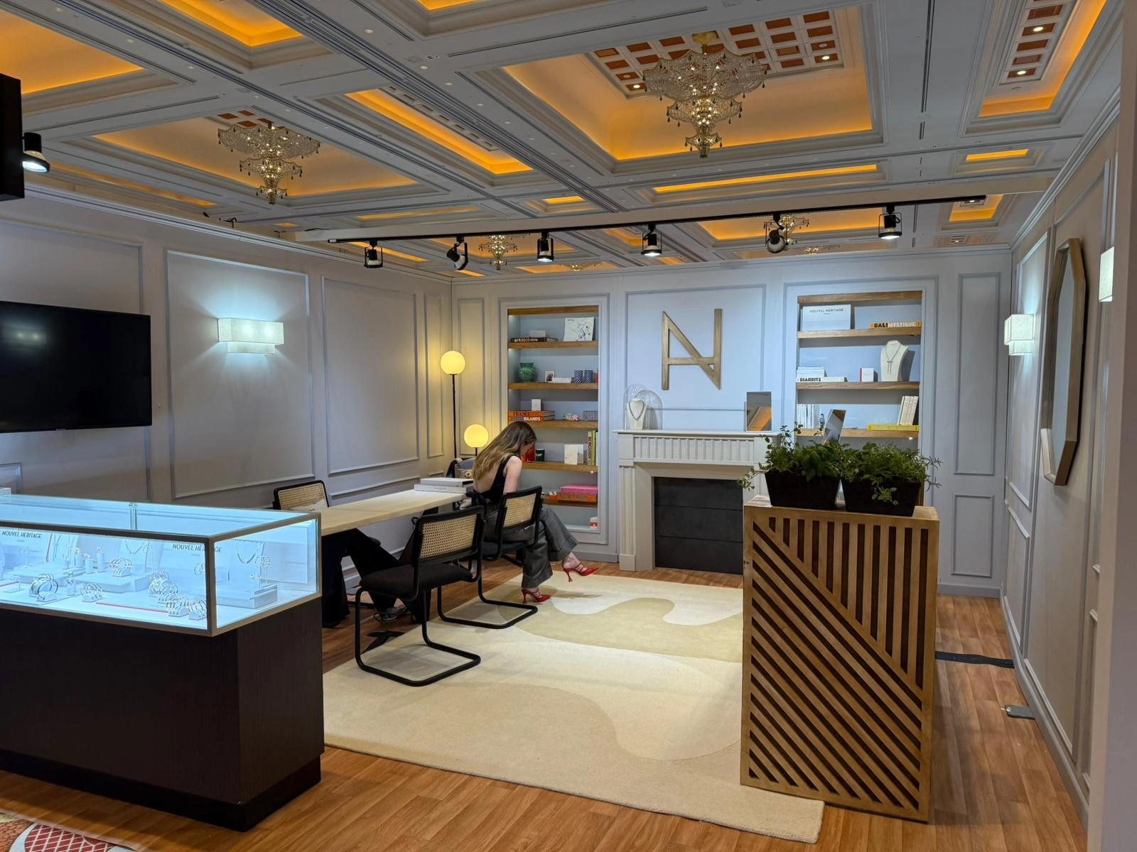Boutique space with illuminated display counter and gold logo