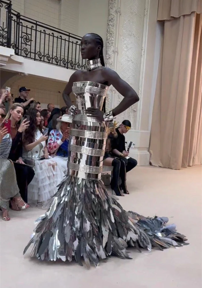 Custom made Feather-embellished garment worn by model on the runway.