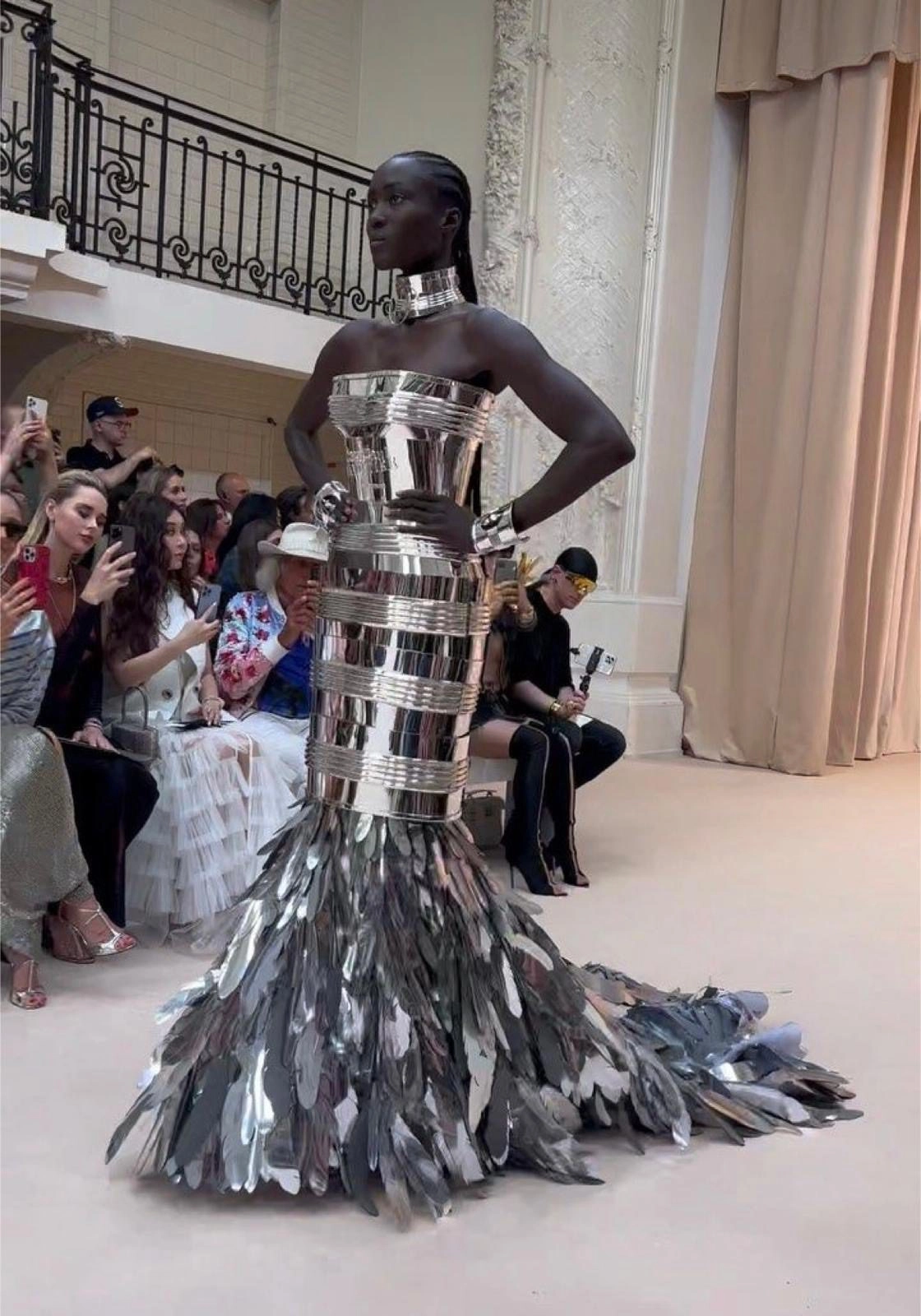 Custom made Feather-embellished garment worn by model on the runway.