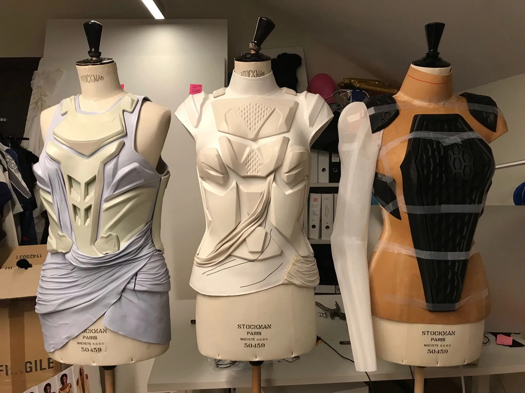 Mannequins with mockups of sculpted bust elements in leather wrap