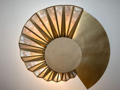 lluminated Helios brass sculpture with mother-of-pearl inlay and central mirror